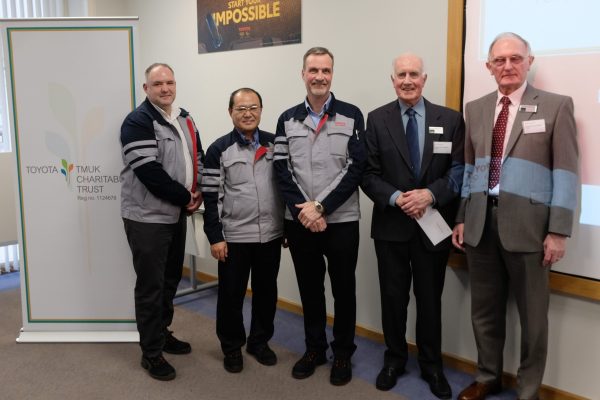 People handing over cheque