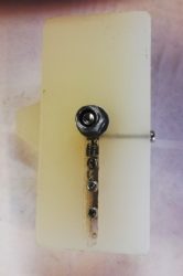 Rear of latch showing spring