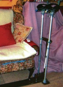 Crutch support for armchair