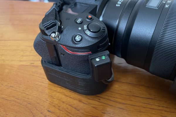The trigger fitted to the camera